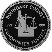 A circular emblem featuring "Boundary County Community Justice" around the edge, an image of Idaho in the background, a balanced scale in the center, and "Est. 1991," showcasing Boundary County ID’s commitment to public service. | Boundary County ID
